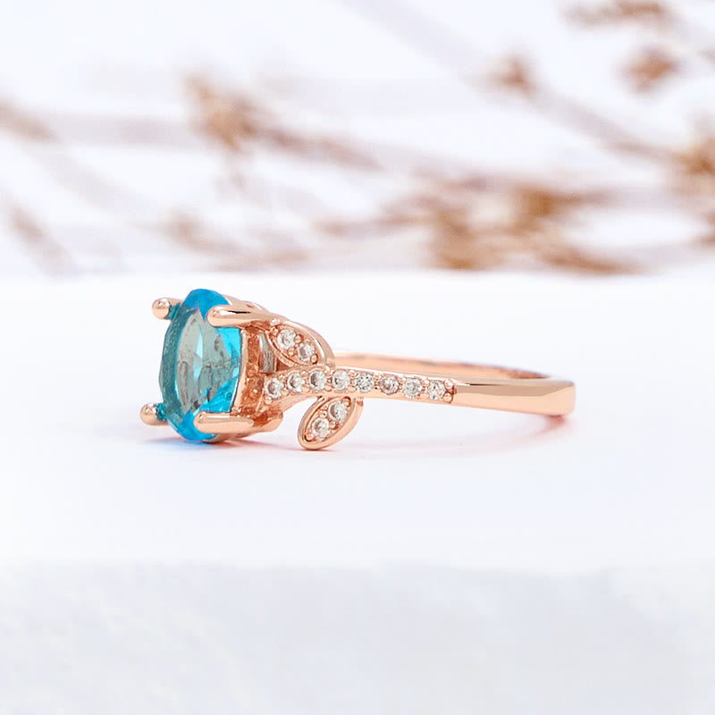 Olivenorma Oval Cut Blue Topaz Wrapped Leaf Ring