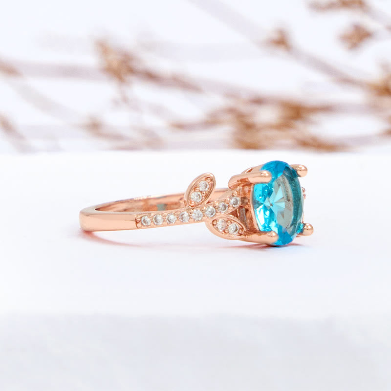 Olivenorma Oval Cut Blue Topaz Wrapped Leaf Ring