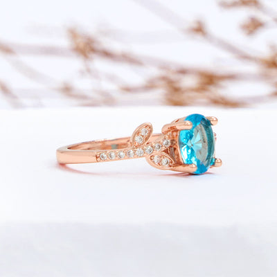 Olivenorma Oval Cut Blue Topaz Wrapped Leaf Ring