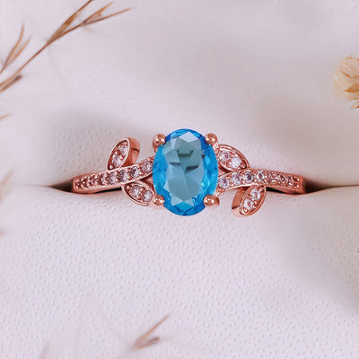 Olivenorma Oval Cut Blue Topaz Wrapped Leaf Ring