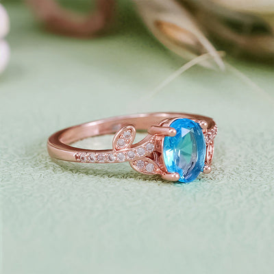 Olivenorma Oval Cut Blue Topaz Wrapped Leaf Ring