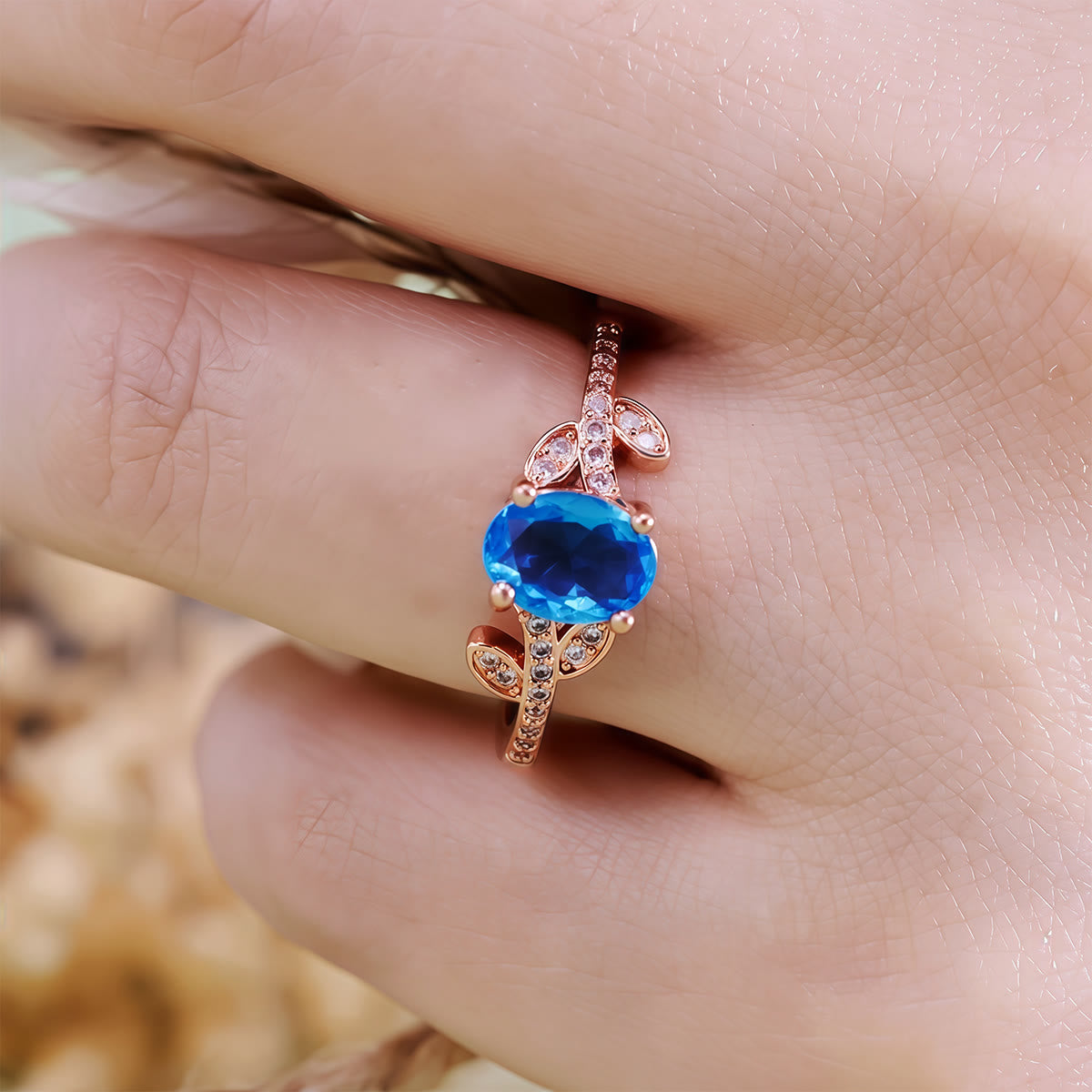 Olivenorma Oval Cut Blue Topaz Wrapped Leaf Ring